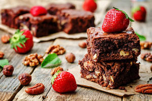 Brownies With Nuts And Strawberries Wallpaper