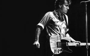 Bruce Springsteen Performing County Fair On Stage Wallpaper