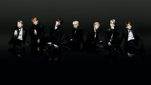 Bts Group Aesthetic Image On A Black Background Wallpaper