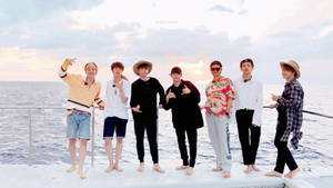Bts Group Photo On A Yacht Wallpaper