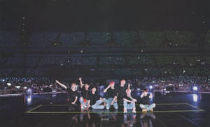 Bts Posing With Armies In A Bts Concert Wallpaper