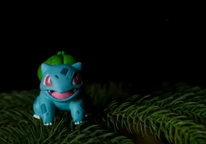 Bulbasaur Toy In Pine Wallpaper