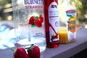 Burnett’s Strawberry Vodka With A Splash Of Grenadine And Orange Juice Cocktail Wallpaper