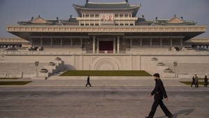 Bustling Crowd At Kim Il-sung Square In Pyongyang Wallpaper