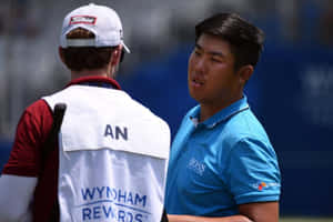 Byeong Hun An Talking To His Caddie Wallpaper