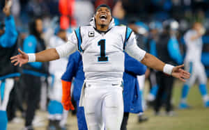 Cam Newton With A Large Smile On His Face During A Carolina Panthers Game Wallpaper