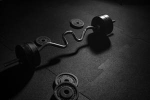 Cambered Barbell And Plates Wallpaper
