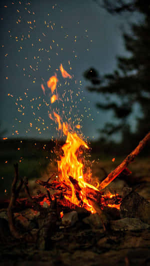 Campfire Closeup Flying Embers Wallpaper