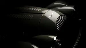 Caption: A Morgan Aero 8 On A Scenic Mountain Road Wallpaper