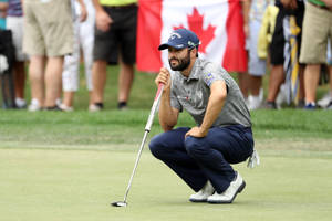 Caption: Adam Hadwin During A Golf Championship Tournament Wallpaper