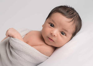 Caption: Adorable Newborn Baby Sleeping Peacefully Wallpaper