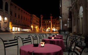 Caption: Al Fresco Dining By Moonlight In Piazza Dei Signori Wallpaper