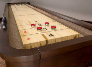 Caption: American Heritage Milan Shuffleboard Game In Action Wallpaper