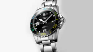 Caption: An Elegant Longines Silver Watch With Colored Bezel Wallpaper