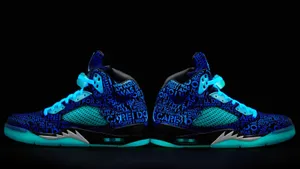 Caption: Blue Jordan Sneakers In Style Wallpaper