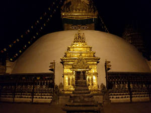 Caption: Boudhanath Stupa Glowing At Night In Kathmandu, Nepal Wallpaper