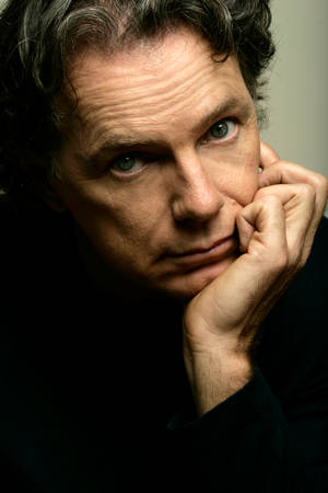 Caption: Canadian Producer Bruce Greenwood Posing For A Portrait Wallpaper