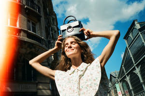 Caption: Chic And Timeless Claudie Pierlot Purse Wallpaper