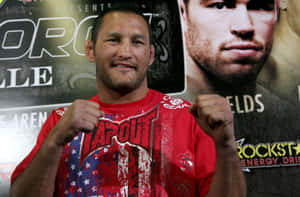 Caption: Dan Henderson, Legendary Mixed Martial Art Fighter In Action Wallpaper