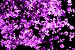 Caption: Dazzling Pink Stars In The Sky Wallpaper