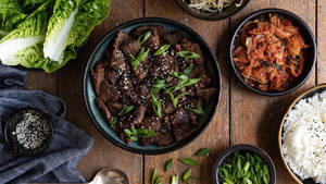 Caption: Delectable Bulgogi With A Sprinkle Of Sesame Seeds Wallpaper