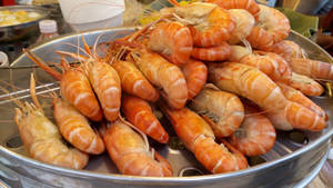 Caption: Delicious Steamed Prawns In Aluminum Container Wallpaper