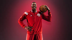 Caption: Dwight Howard Shooting A Slam Dunk Wallpaper