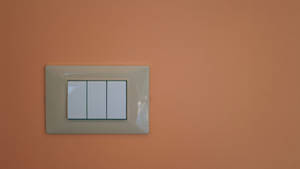 Caption: Elegant European Light Switch Cover Wallpaper