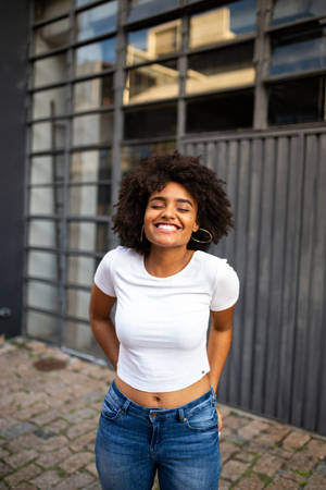 Caption: Empowered Elegance - A Black Woman In A Crisp White Shirt Wallpaper