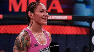 Caption: Empowering Smile Of Cris Cyborg, The American Ufc Athlete Wallpaper