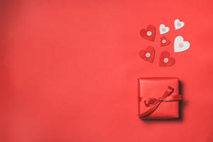 Caption: Exquisite Red 4k Uhd Ribbon Gift Box Wallpaper