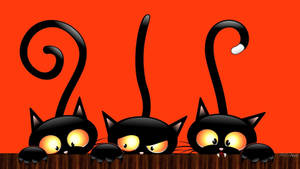 Caption: Gleeful Gathering Of Cute Black Cartoon Cats On A Laptop Wallpaper
