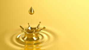 Caption: Glistening Golden Droplet Wallpaper
