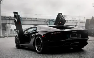 Caption: High Speed Adrenaline - Sports Car In Action Wallpaper