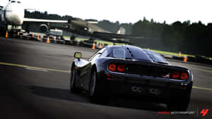 Caption: Intense Racing Action In Forza Motorsport Wallpaper