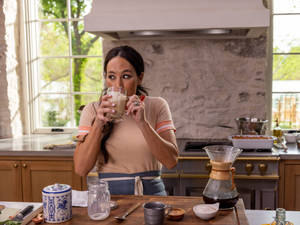 Caption: Joanna Gaines Enjoying Her Coffee Time Wallpaper