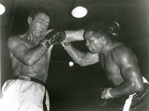 Caption: Joey Maxim Displaying Valor In The Ring Wallpaper