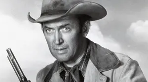 Caption: Legendary Actor James Stewart Exuding An Effortless Cowboy Style. Wallpaper