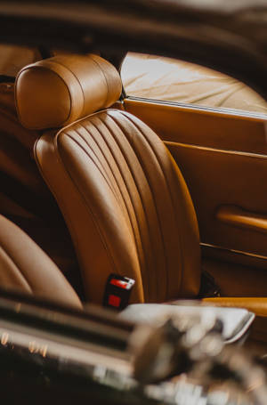 Caption: Luxurious Brown Car Seats Background For Iphone Wallpaper
