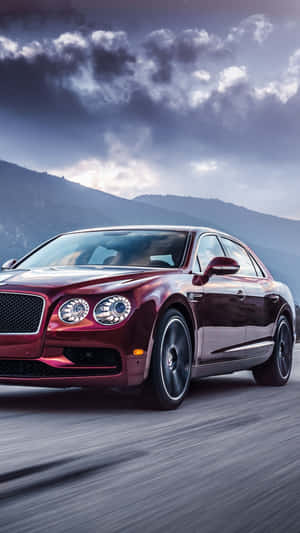 Caption: Luxury In Hand - A Bently Iphone Experience Wallpaper