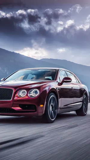 Caption: Luxury In Hand - A Bently Iphone Experience Wallpaper