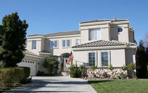 Caption: Majestic House With A Gray Roof Wallpaper