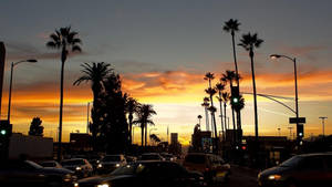 Caption: Majestic Los Angeles Sunset Over The Iconic Boulevard Wallpaper