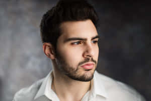 Caption: Man's Portrait With Neatly Trimmed Beard Wallpaper