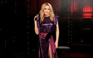 Caption: Pop Icon Kylie Minogue Captivating In Concert Wallpaper
