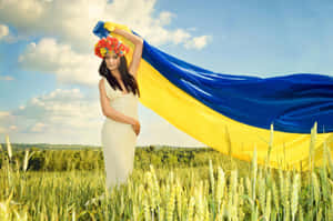 Caption: Pride In Roots - Ukrainian Girl Waving Flag Wallpaper