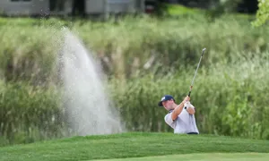 Caption: Professional Golf Player - Michael Thompson In Swing Action Wallpaper