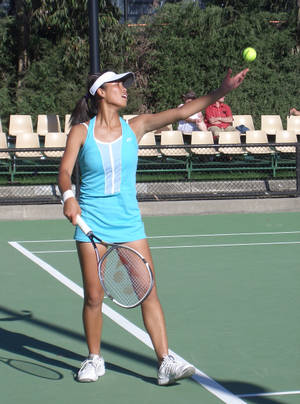 Caption: Professional Tennis Player Su-wei Hsieh Preparing To Serve During A Match Wallpaper