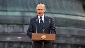 Caption: Russian President Vladimir Putin Delivering A Speech At A Ceremonial Event. Wallpaper