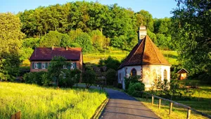 Caption: Serene English Village Nestled In The Lush Green Countryside Wallpaper